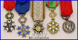 Barrette avec 4 Ordres +1 Médaille miniatures. France. Or, argent