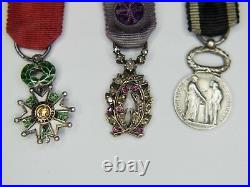 Chaînette de miniatures comprenant une médaille de la légion d'honneur, palmes