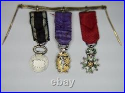 Chaînette de miniatures comprenant une médaille de la légion d'honneur, palmes