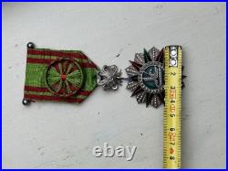 Croix de chevalier de l'ordre du Nicham Iftikar en argent, émaillée