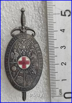 GUERRE 1914-1918 INSIGNE DES BLESSES EN ARGENT en forme de bouclier