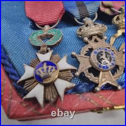 Lot de 4 médailles de décoration militaire / quelques défauts d'émail /