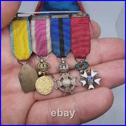 Lot de 4 médailles de décoration militaire / quelques défauts d'émail /