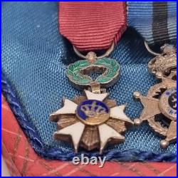 Lot de 4 médailles de décoration militaire / quelques défauts d'émail / belge