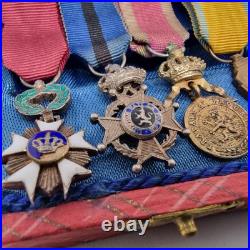 Lot de 4 médailles de décoration militaire / quelques défauts d'émail / belge