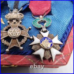 Lot de 4 médailles de décoration militaire / quelques défauts d'émail / belge