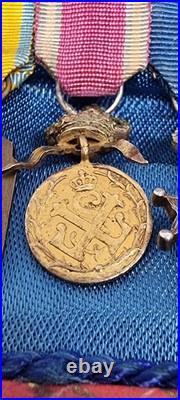 Lot de 4 médailles de décoration militaire / quelques défauts d'émail / belge