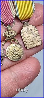 Lot de 4 médailles de décoration militaire / quelques défauts d'émail / belge