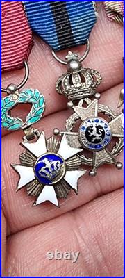 Lot de 4 médailles de décoration militaire / quelques défauts d'émail / belge