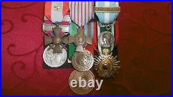 Lot de DECORATIONS LEGION ETRANGERE (placard + 7 médailles pendantes)