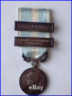 Médaille Coloniale + très rare agrafe Côte d'Ivoire à clapet arrondi + AOF