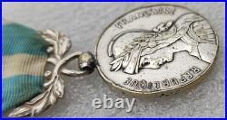 MEDAILLE COLONIALE modèle EPAULE HAUTE AVEC DES CHOCS