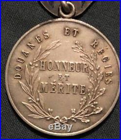 Médaille d'honneur des douanes et régies de l'Indochine, 1er type variante