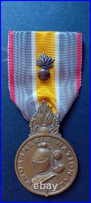 Médaille de la Gendarmerie Nationale. Modèle avec poinçon, revers de la grenade
