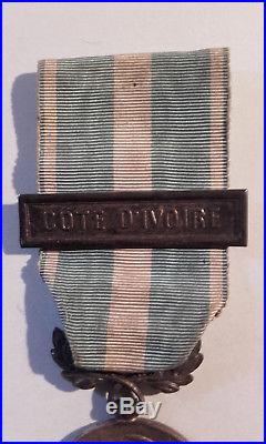RARE médaille coloniale, agrafe à clapet COTE D'IVOIRE
